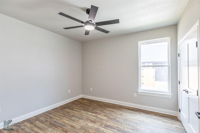6718 Windmill Grass Ln, Abilene, TX 79606 - unfurnished room featuring wood finished floors, ceiling fan, and baseboards