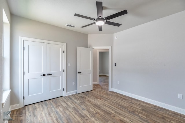 6718 Windmill Grass Ln, Abilene, TX 79606 - unfurnished bedroom featuring wood finished floors, baseboards, and a closet