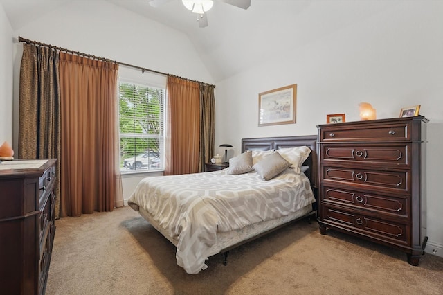 bedroom featuring lofted ceiling, light colored carpet, and a ceiling fan