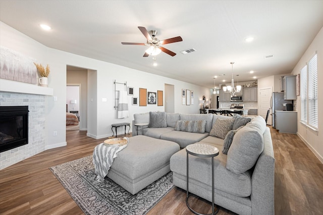 14320 Padden Park Ln, Fort Worth, TX 76262 - living room with baseboards, a ceiling fan, a brick fireplace, wood finished floors, and recessed lighting