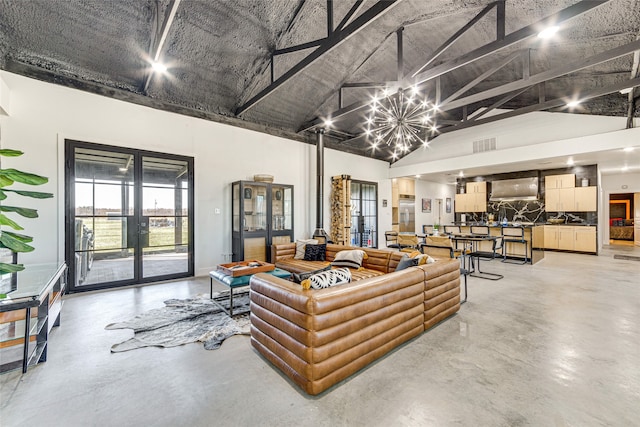1841 Rs County Road 1402, Point, TX 75472 - living area with french doors, concrete floors, a chandelier, and high vaulted ceiling
