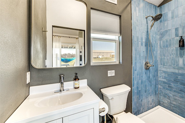 1841 Rs County Road 1402, Point, TX 75472 - bathroom featuring tiled shower, toilet, and vanity