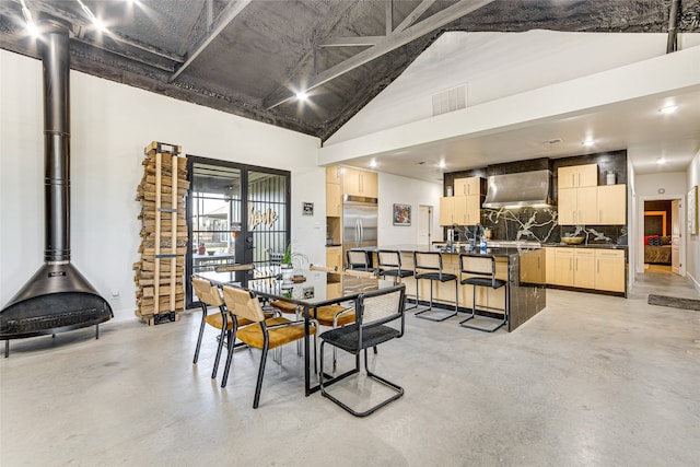 1841 Rs County Road 1402, Point, TX 75472 - dining room featuring concrete floors, high vaulted ceiling, and baseboards