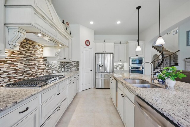 3604 Mendocino Trl, Mckinney, TX 75070 - kitchen featuring stainless steel appliances, a sink, decorative backsplash, white cabinets, and recessed lighting