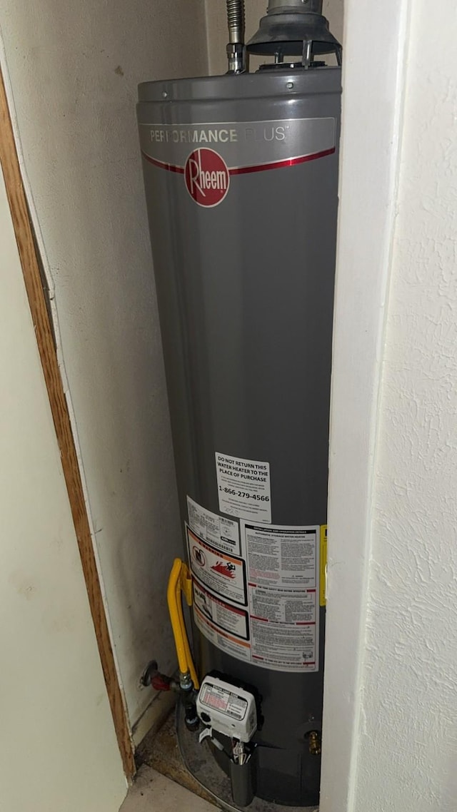 1213 Travis St, Garland, TX 75040 - utility room with water heater