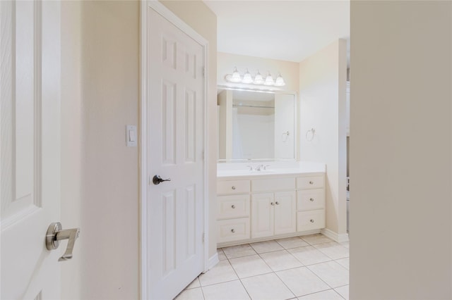 1003 E Burnett St, Ennis, TX 75119 - bathroom featuring tile patterned flooring and vanity