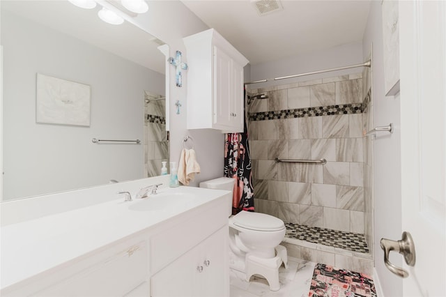 1003 E Burnett St, Ennis, TX 75119 - bathroom with marble look tiles, tiled shower, toilet, and vanity