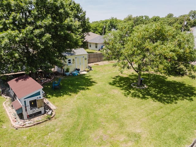 1003 E Burnett St, Ennis, TX 75119 - view of yard featuring an outdoor structure and a storage shed