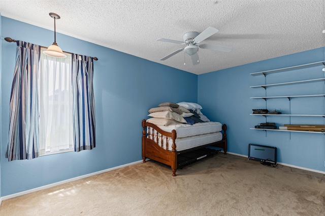 4611 Francis Ct, Granbury, TX 76049 - bedroom with carpet floors, a textured ceiling, baseboards, and a ceiling fan