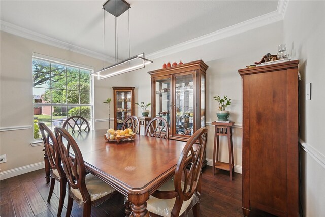 14766 Daneway Dr, Frisco, TX 75035 - dining room featuring ornamental molding, dark wood-style flooring, and baseboards
