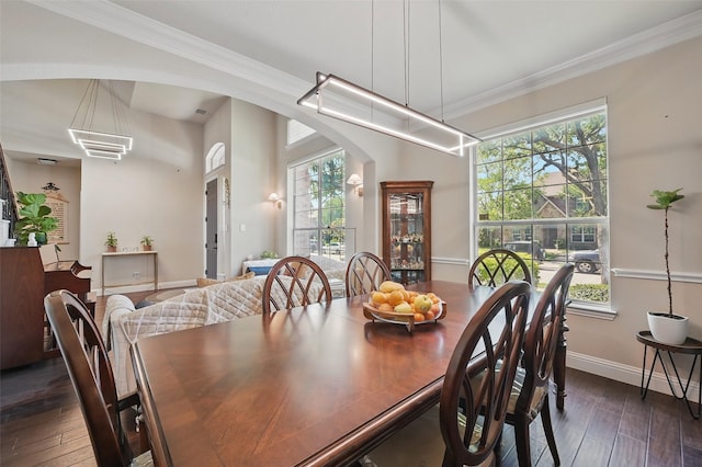 14766 Daneway Dr, Frisco, TX 75035 - dining room featuring arched walkways, hardwood / wood-style flooring, baseboards, and ornamental molding