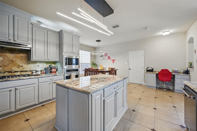 14766 Daneway Dr, Frisco, TX 75035 - kitchen with appliances with stainless steel finishes, gray cabinetry, backsplash, and light tile patterned floors