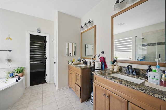 14766 Daneway Dr, Frisco, TX 75035 - bathroom featuring a shower stall, two vanities, tile patterned floors, and a bath