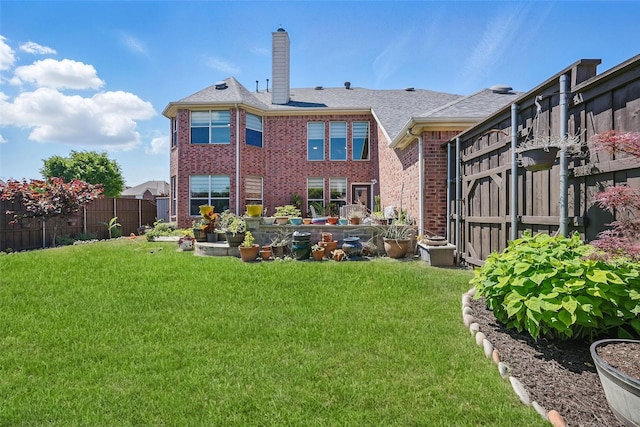 14766 Daneway Dr, Frisco, TX 75035 - rear view of property featuring a chimney, brick siding, and roof with shingles