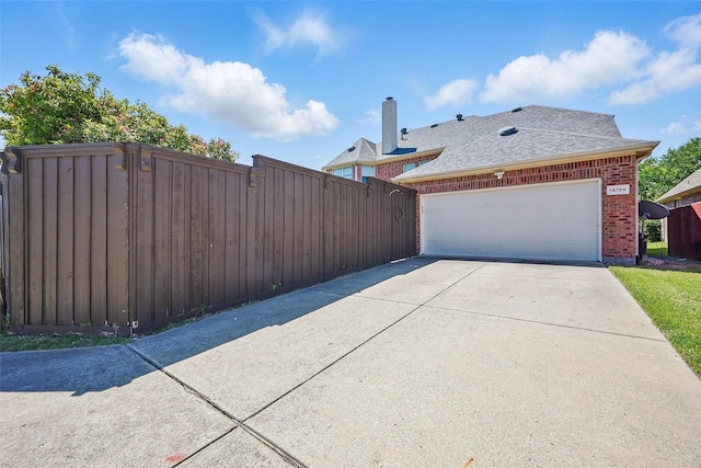 14766 Daneway Dr, Frisco, TX 75035 - view of side of property featuring brick siding, driveway, and roof with shingles