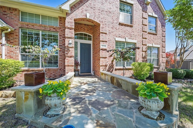 14766 Daneway Dr, Frisco, TX 75035 - view of exterior entry featuring brick siding