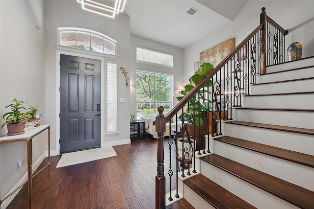 14766 Daneway Dr, Frisco, TX 75035 - entryway with baseboards, dark wood-type flooring, stairway, and a towering ceiling