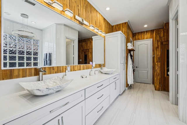 7012 Mills Branch Cir, Plano, TX 75024 - bathroom featuring recessed lighting, wooden walls, double vanity, marble finish flooring, and ornamental molding