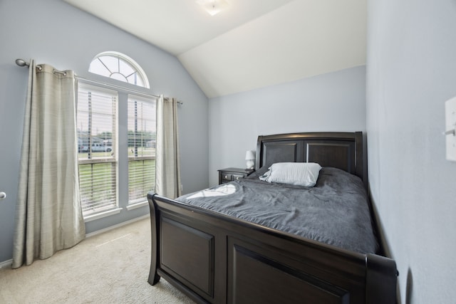 201 E St, Josephine, TX 75173 - bedroom featuring lofted ceiling, light carpet, and baseboards