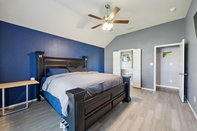 201 E St, Josephine, TX 75173 - bedroom featuring wood finished floors, lofted ceiling, baseboards, a ceiling fan, and connected bathroom