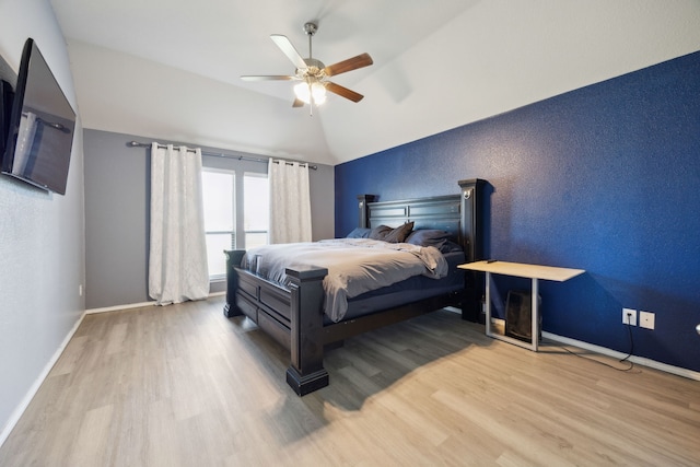 201 E St, Josephine, TX 75173 - bedroom featuring wood finished floors, vaulted ceiling, baseboards, and a ceiling fan