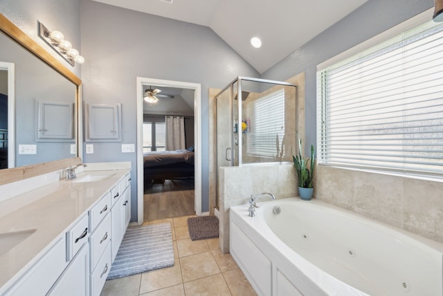 201 E St, Josephine, TX 75173 - bathroom featuring ensuite bath, healthy amount of natural light, vaulted ceiling, tile patterned flooring, and a shower stall