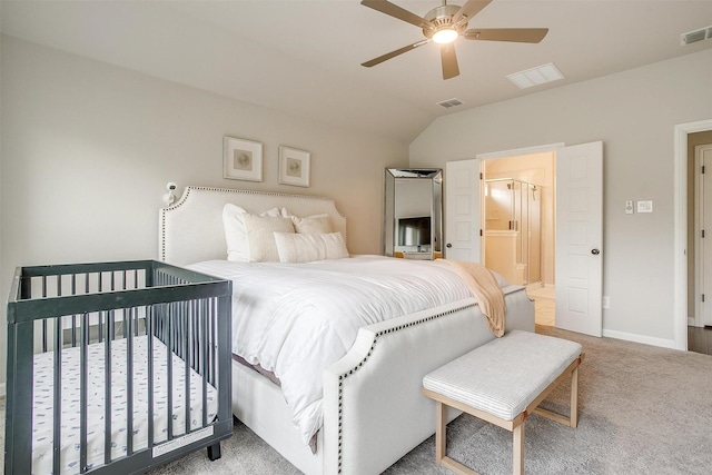 carpeted bedroom featuring lofted ceiling, baseboards, and a ceiling fan