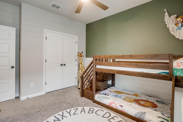 bedroom with carpet floors, ceiling fan, and a closet