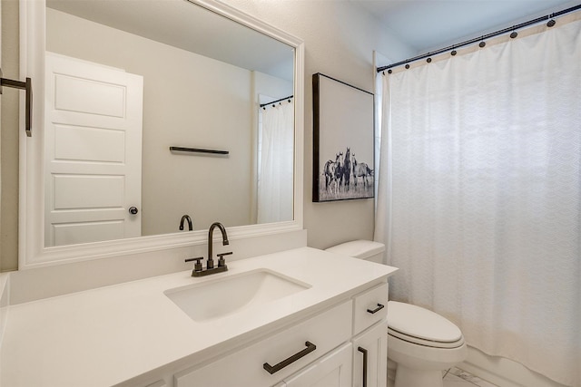 full bathroom with toilet and vanity