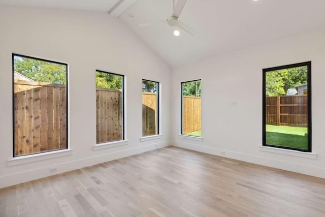 empty room featuring light wood finished floors, beam ceiling, ceiling fan, baseboards, and high vaulted ceiling