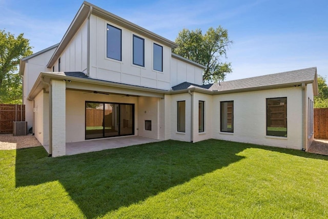 back of house with board and batten siding, a ceiling fan, a patio, and central AC unit