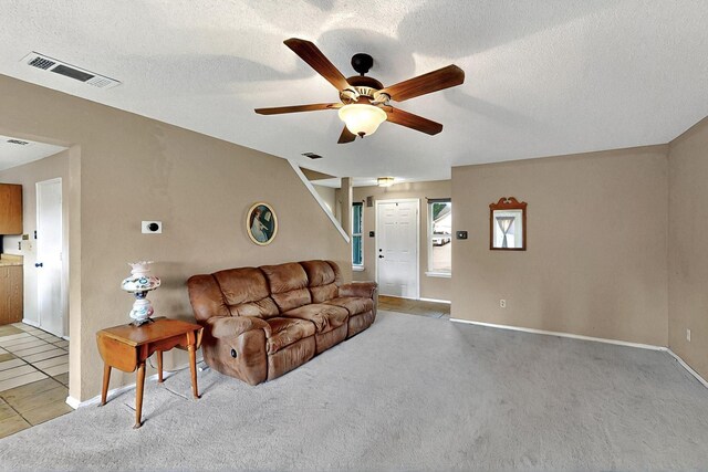 4821 Abbott Ave, Arlington, TX 76018 - living room featuring ceiling fan, light colored carpet, baseboards, and a textured ceiling