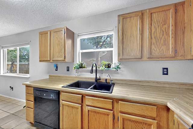 4821 Abbott Ave, Arlington, TX 76018 - kitchen featuring dishwasher, a sink, a textured ceiling, light countertops, and light tile patterned floors