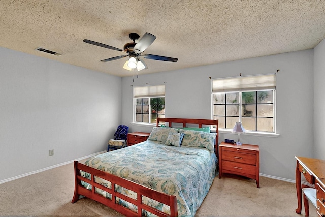 4821 Abbott Ave, Arlington, TX 76018 - carpeted bedroom with baseboards, a textured ceiling, and a ceiling fan