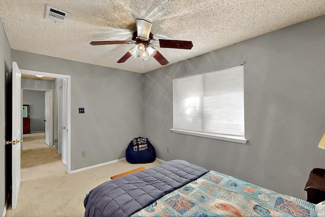 4821 Abbott Ave, Arlington, TX 76018 - carpeted bedroom featuring a ceiling fan, a textured ceiling, and baseboards