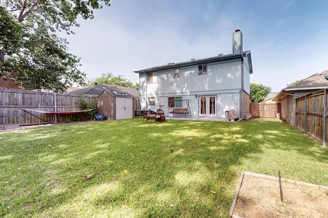 4821 Abbott Ave, Arlington, TX 76018 - rear view of property with a shed, an outdoor structure, a patio, french doors, and a chimney