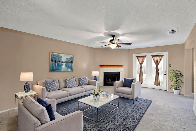 4821 Abbott Ave, Arlington, TX 76018 - carpeted living room featuring ceiling fan, baseboards, a textured ceiling, and a fireplace