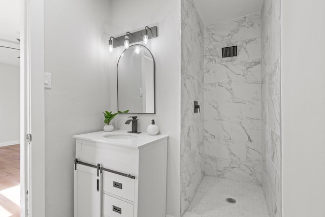 1304 Barnes Dr, Arlington, TX 76013 - bathroom featuring vanity and a marble finish shower