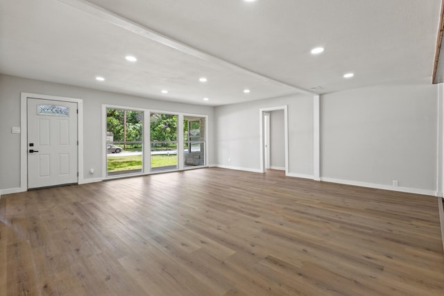 1304 Barnes Dr, Arlington, TX 76013 - unfurnished living room with recessed lighting, wood finished floors, and baseboards