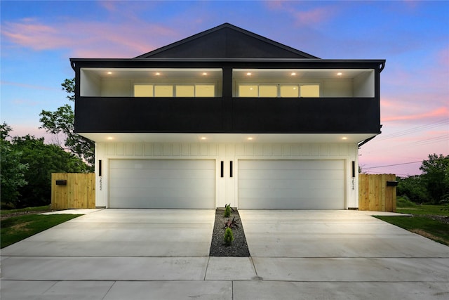 2522 Jeffries St, Dallas, TX 75215 - contemporary home featuring a garage, fence, and concrete driveway