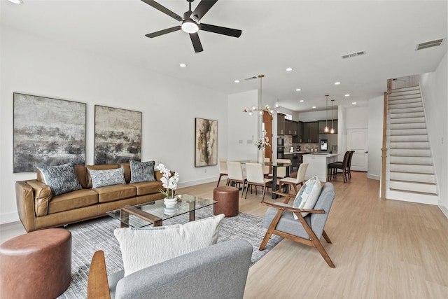 2522 Jeffries St, Dallas, TX 75215 - living area with baseboards, stairway, light wood-type flooring, ceiling fan, and recessed lighting