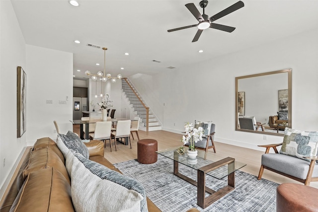 2522 Jeffries St, Dallas, TX 75215 - living room featuring stairs, light wood-style floors, recessed lighting, a chandelier, and baseboards