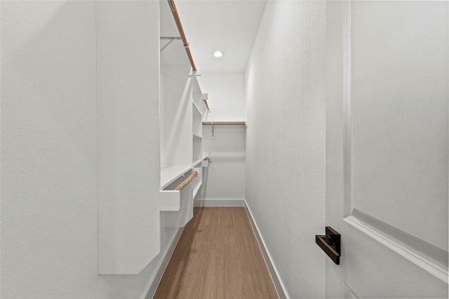 2522 Jeffries St, Dallas, TX 75215 - walk in closet featuring wood finished floors