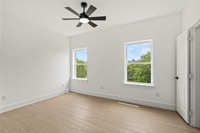 2522 Jeffries St, Dallas, TX 75215 - unfurnished room featuring light wood-style flooring, baseboards, and a ceiling fan