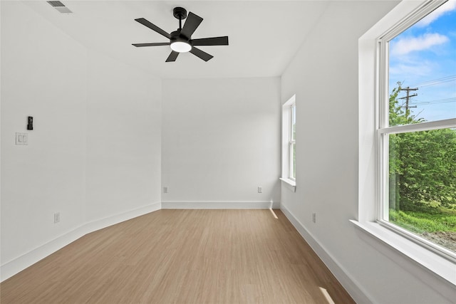 2522 Jeffries St, Dallas, TX 75215 - unfurnished room with plenty of natural light, wood finished floors, baseboards, and a ceiling fan