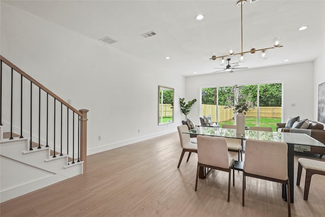 2522 Jeffries St, Dallas, TX 75215 - dining space with light wood-style floors, recessed lighting, stairway, a chandelier, and baseboards