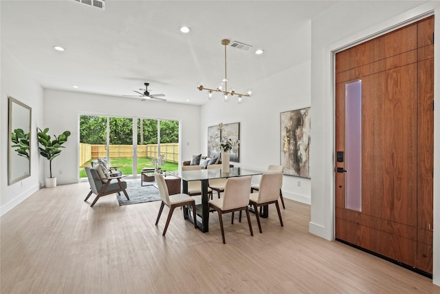 2522 Jeffries St, Dallas, TX 75215 - dining space featuring light wood-type flooring, baseboards, recessed lighting, ceiling fan, and a chandelier