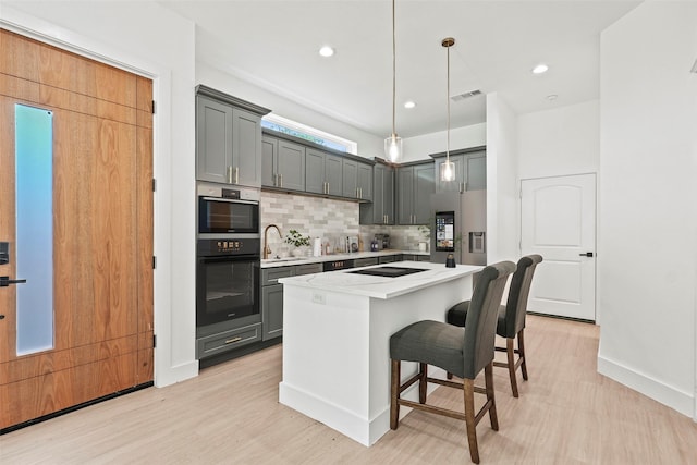 2522 Jeffries St, Dallas, TX 75215 - kitchen featuring stainless steel fridge with ice dispenser, gray cabinets, a sink, double oven, and recessed lighting