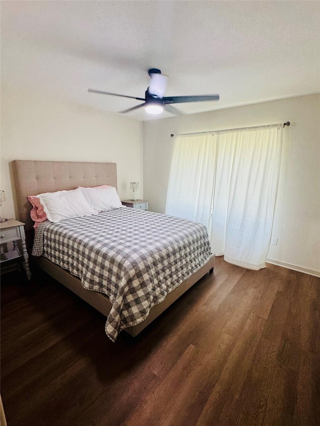 900 Boyd Ave, Lindale, TX 75701 - bedroom with wood finished floors, a ceiling fan, and baseboards