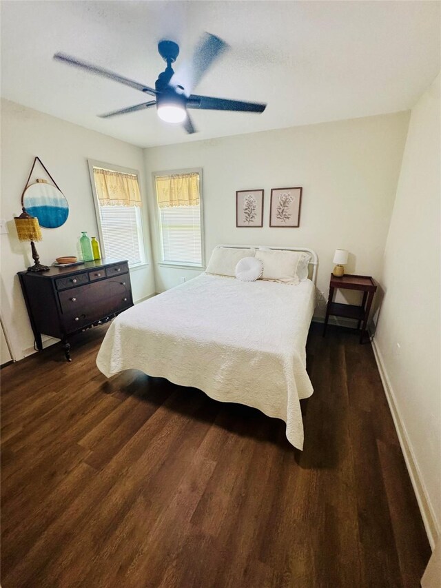 900 Boyd Ave, Lindale, TX 75701 - bedroom with wood finished floors, a ceiling fan, and baseboards